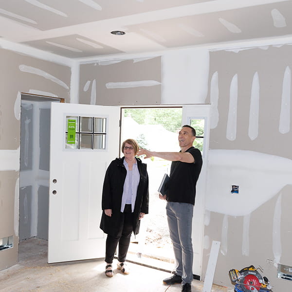 NJ general contractor shaking hands with satisfied homeowner